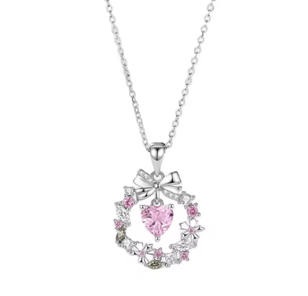 Conjunto de joyería con exquisito collar, fascinante dije y delicados aretes de corazón adornados con circonitas rosadas - Aurora Boré