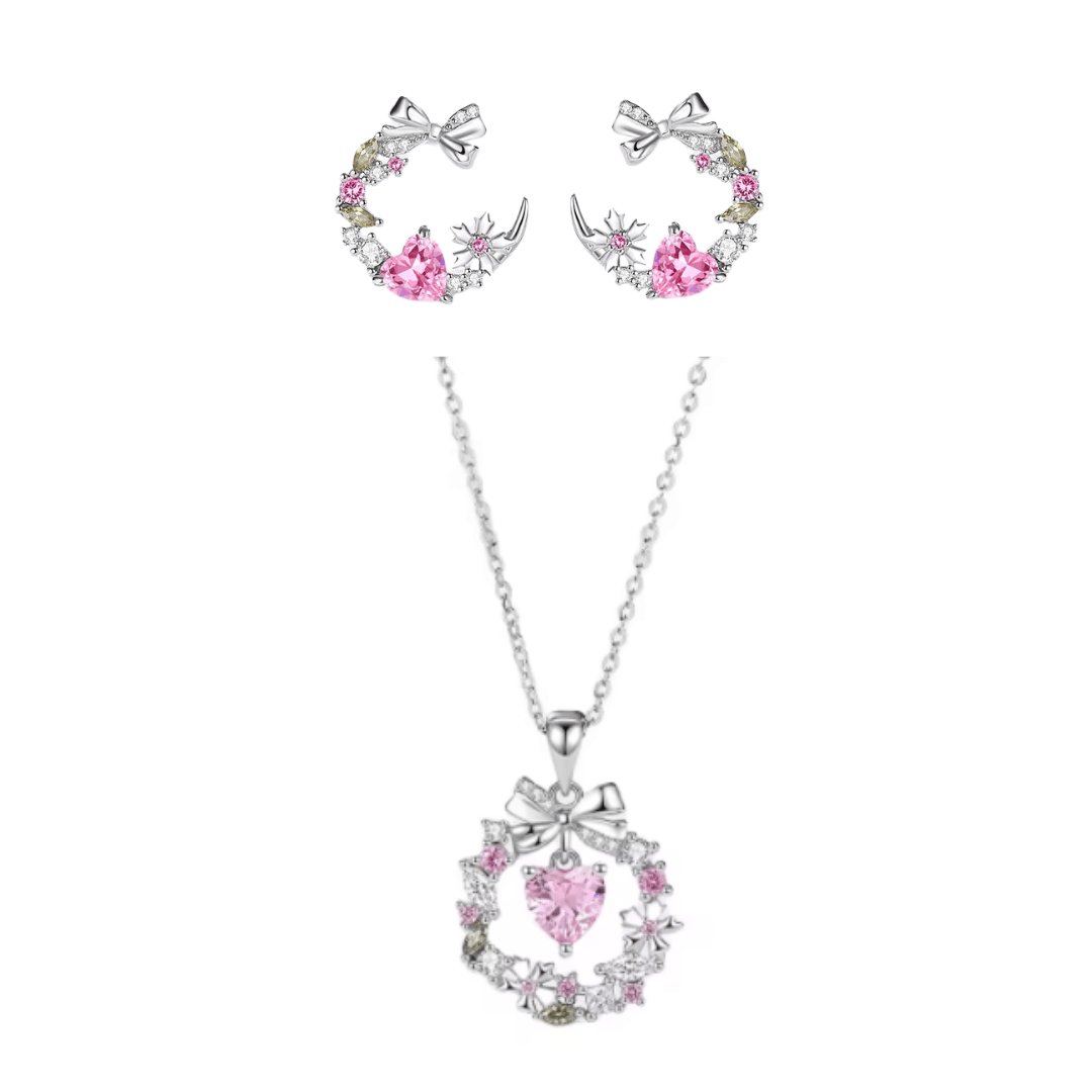 Conjunto de joyería con exquisito collar, fascinante dije y delicados aretes de corazón adornados con circonitas rosadas