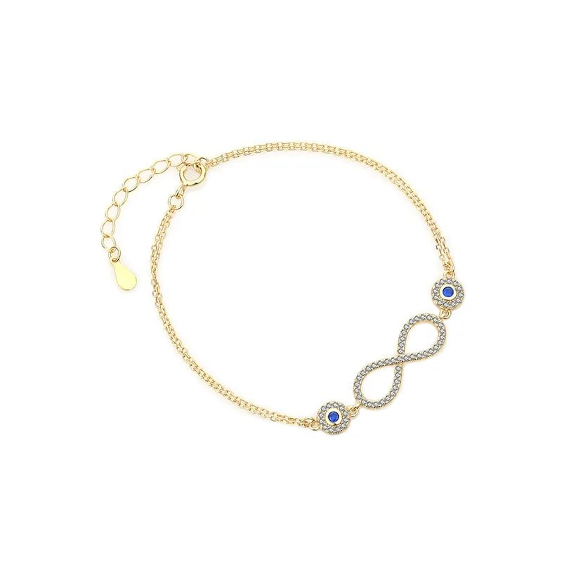 Pulsera de plata 925 con baño de oro 18K es una obra maestra. Infinito diseño y piedra azul. Un regalo único para la mujer moderna.