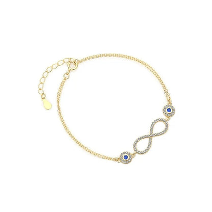 Pulsera de plata 925 con baño de oro 18K es una obra maestra. Infinito diseño y piedra azul. Un regalo único para la mujer moderna.